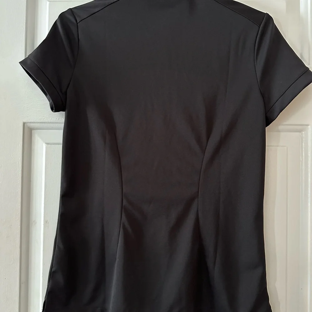 Nike Golf Dri Fit black short sleeve polo shirt. Size medium.‎